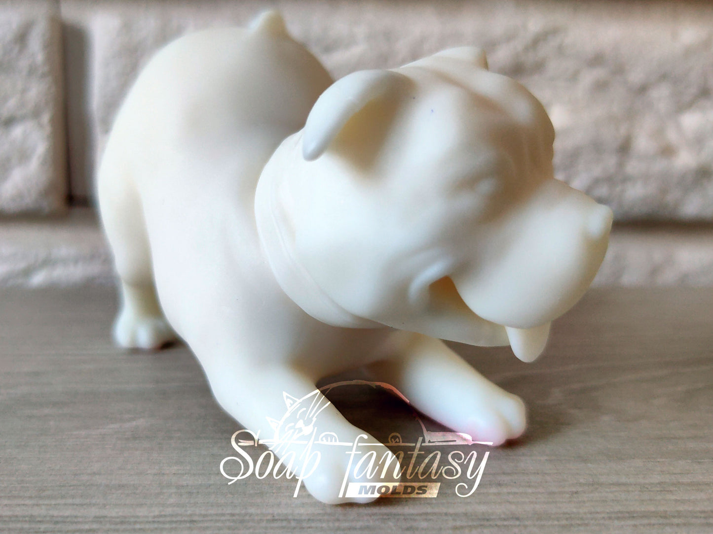 Pitbull is playing silicone mold for soap making