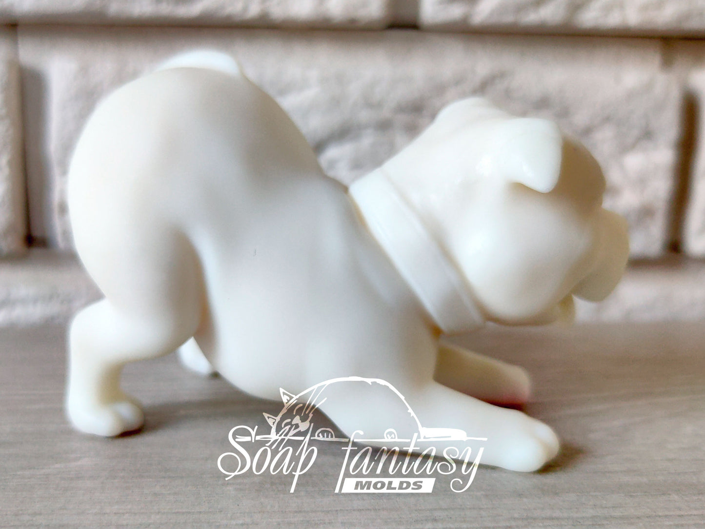 Pitbull is playing silicone mold for soap making