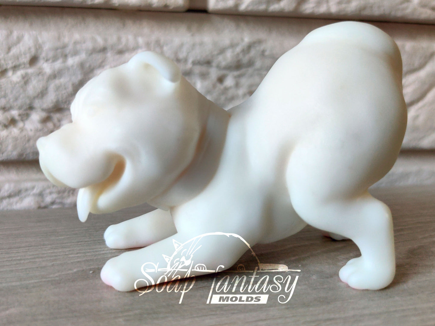 Pitbull is playing silicone mold for soap making