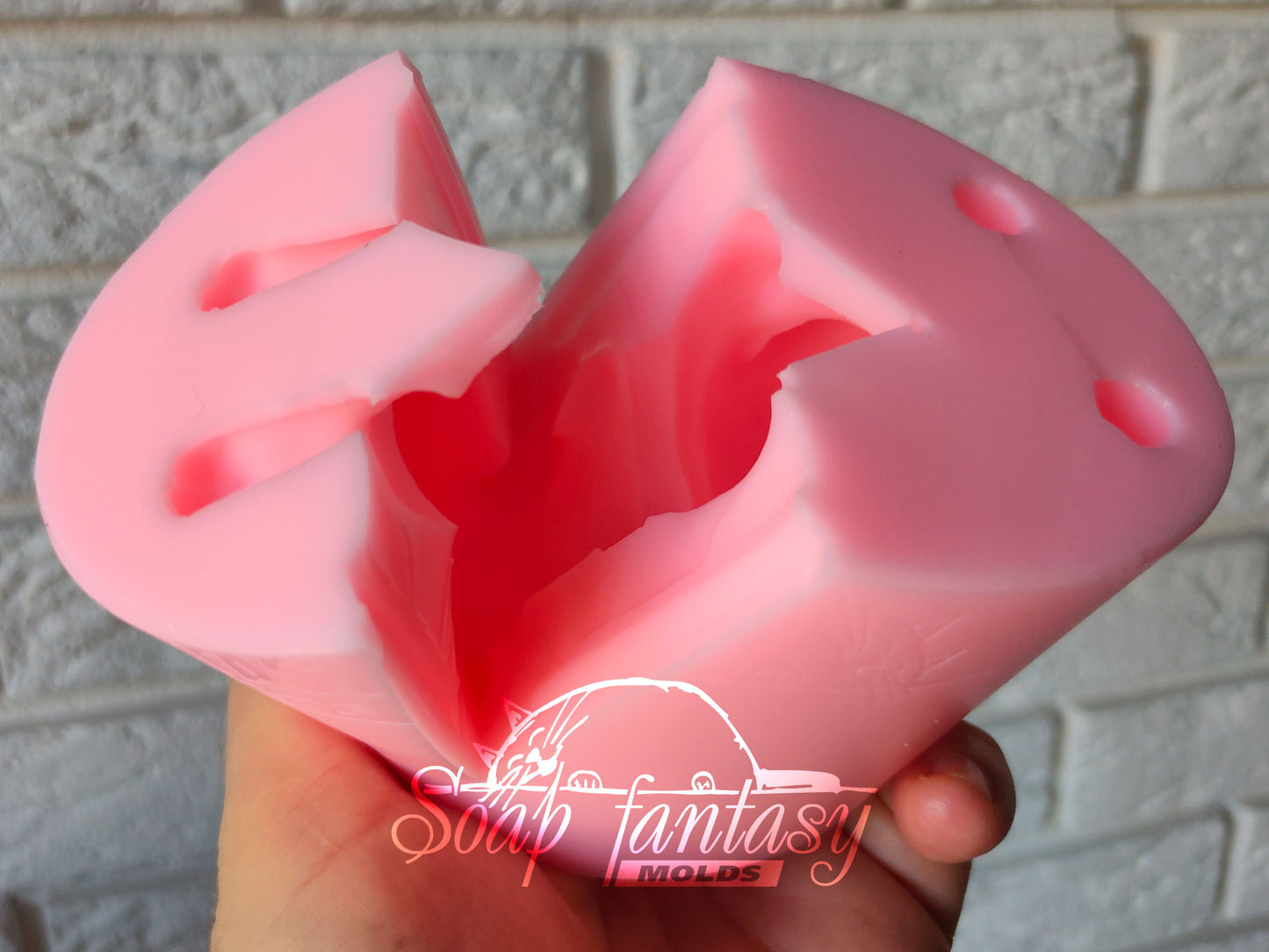 Pitbull is playing silicone mold for soap making