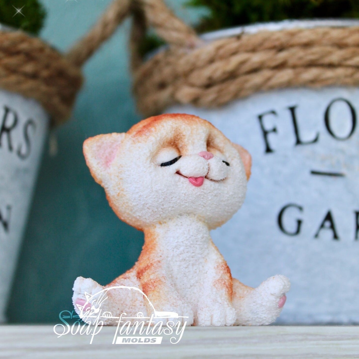 Cat squinting sun silicone mold (mould) for soap making and candle making.